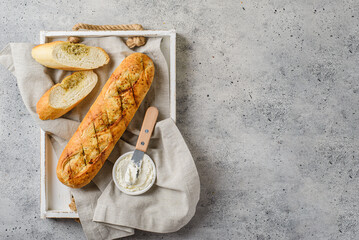 garlic baguette on a gray background