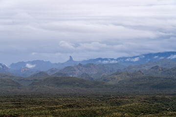 The enchanting Superstition Wilderness on a wet spring day. Weaver's Needle can be seen in the...