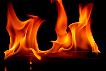Flames burn horizontally with a black background.
