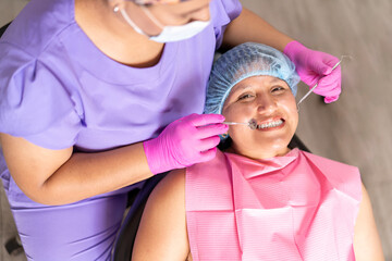 Cheerful Patient with Dentist During Oral Health Check