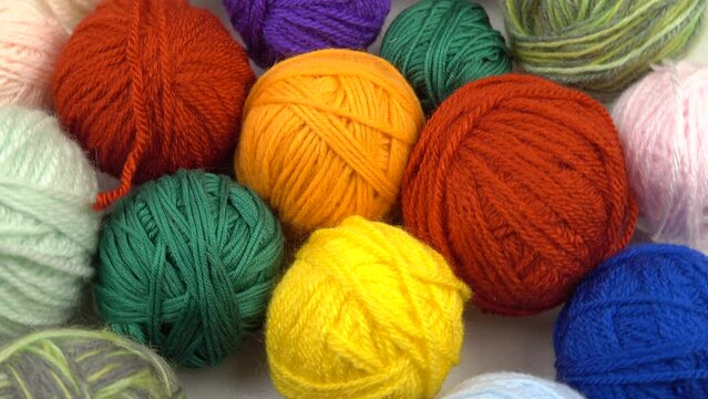 Set of the multi-colored balls of threads for hand knitting, background