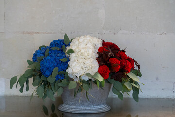 an arrangement of blue, white and red flowers to symbolise the French tricolore