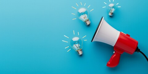 Megaphone and light bulbs on blue background, marketing ideas concept