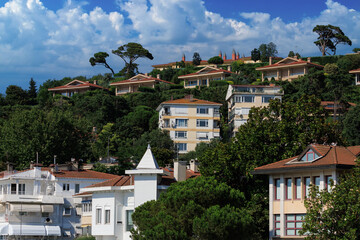 Beautiful houses and city streets of the southern city with green plants, public place in Turkey, on a summer sunny day