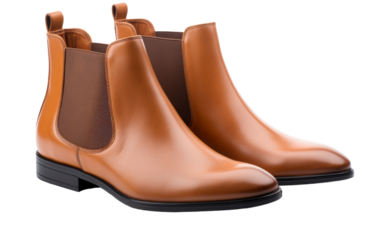 A pair of stylish chestnut Chelsea boots enticingly displayed against a pristine white backdrop
