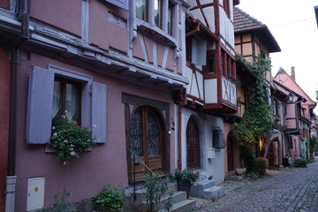 Fototapeta na wymiar closeup on downtown Eguisheim in eastern France, Alsace with their typical half timbered colorful buildings