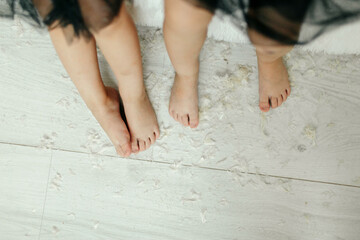 Person Standing Barefoot on White Floor