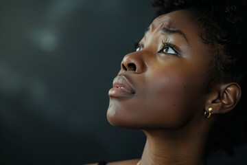 Touched by His Grace, beautiful young black woman looking up with tears, emotional Christian concept - obrazy, fototapety, plakaty