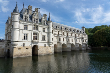 a large white country mansion with normandy style turrets, Chateau de Chenonceau Castle, France