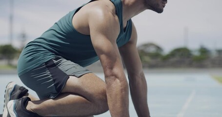 Man, runner and starting blocks on field for race competition ready for challenge, speed or training. Male person, feet and ground or stadium exercise for marathon performance, achievement or cardio