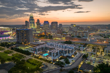 Cincinnati Ohio USA night urban landscape. Downtown district skyline with brightly illuminated high...