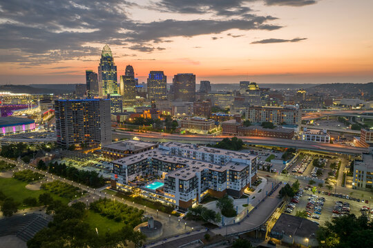 Cincinnati Ohio USA night urban landscape. Downtown district skyline with brightly illuminated high skyscraper buildings in modern American megapolis