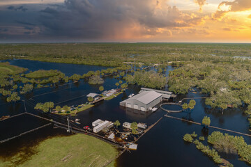 Consequences of natural disaster. Flooded industrial business warehouse by hurricane Ian rainfall...