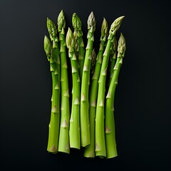 Bunch of fresh green asparagus on a black background