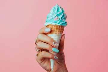 Foto auf Alu-Dibond A woman's hand holding a pink ice cream cone in pink background © LidiaLens
