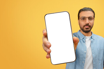 Man showing smartphone with blank screen