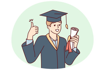 Graduate guy in academic gown and hat holds bundle with diploma and shows thumbs up. University student rejoices in getting quality education in good educational institution