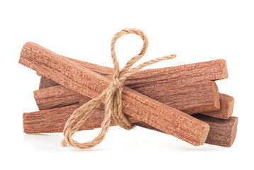 Sandalwood sticks tied with rope isolated on a white background. Chandan.