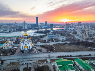 Spring Yekaterinburg, Temple on Blood and Church of St Nicholas in sunset. Aerial view of Yekaterinburg, Russia. Translation of text on the temple: Honest to the Lord is the death of His saints - obrazy, fototapety, plakaty