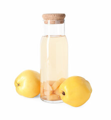 Tasty quince drink in glass carafe and fresh fruits isolated on white