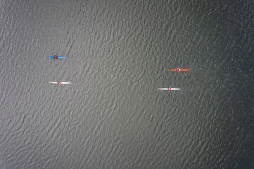 Kayaking top view. Group of kayaks rowing. Aerial view from drone.