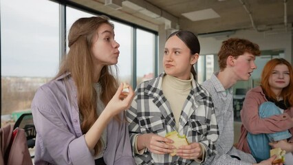 High school students eating sandwiches on lunch