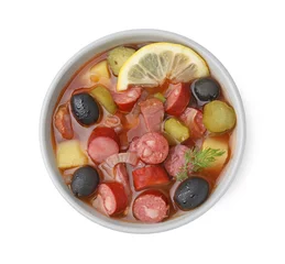 Foto op Canvas Meat solyanka soup with thin dry smoked sausages in bowl isolated on white, top view © New Africa