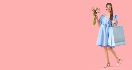 Pregnant woman with bouquet of beautiful flowers and shopping bags on pink background with space for text