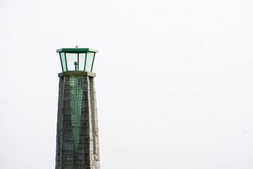 green lighthouse against the sky