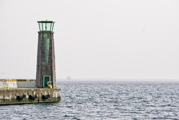 green lighthouse in the sea