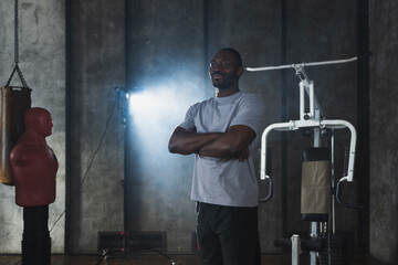 Fitness workout in gym. Portrait of African American man standing in gym with motivation health energy ready for training. Athletic coach personal trainer fitness club owner. Healthy lifestyle