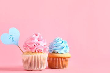 Delicious cupcakes with question mark on color background. Gender reveal party concept