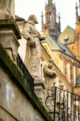 Detail of an old statue in the city center with the cathedral in the background in Brno, Czech...