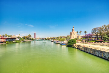 Golden Tower (Torre del Oro) with Guadalquivir River in Seville during a Sunny Day, Andalusia