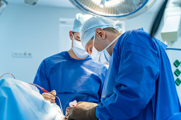 Surgery process in teamwork. Sterile uniform medical specialist.