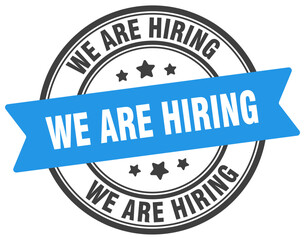 Obraz premium we are hiring stamp. we are hiring label on transparent background. round sign