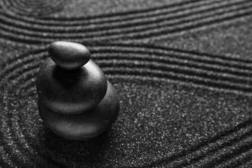 Foto auf Glas Spa stones on black sand with lines, closeup. Zen concept © Pixel-Shot