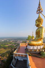 Scenic view of the surrounding area and a big golden Buddha statue on top of the mountain at the...