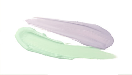 Strokes of green and purple color correcting concealers isolated on white, top view