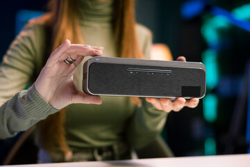 Teenage online star in home studio filming video about best bluetooth music playing devices of the...