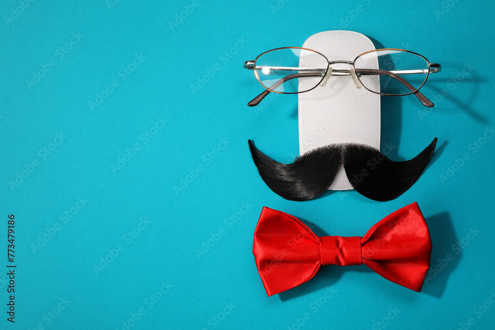 Wall mural flat lay composition with artificial moustache and glasses on light blue background, space for text