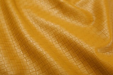Beautiful yellow leather as background, closeup view