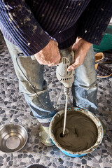 Paddle for mixing tile concrete adhesive grout attachment for power drill.