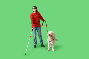 Blind woman with guide dog on green background