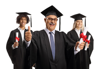 Graduation students and a mature man holding certificates and gesturing thumbs up