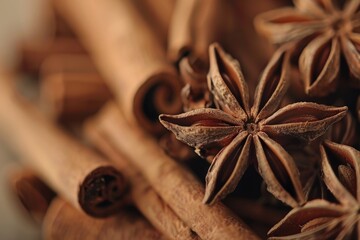 Obraz na płótnie Canvas A pile of cinnamon sticks and star anise. Perfect for food and spice related projects