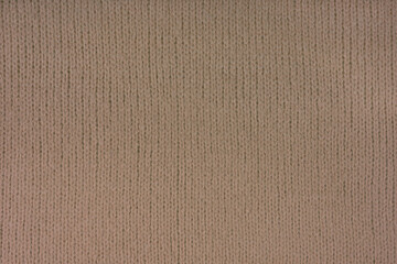 Brown knitted woolen jersey fabric, sweater, pullover texture background. Fabric abstract backdrop,...