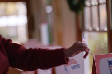 Shallow depth of field (selective focus) image with the hand of a person voting in the US presidential elections. 