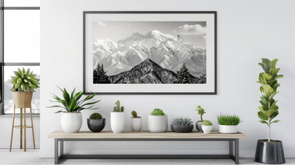 A black and white photograph of a snowcovered mountain framed by light wood and surrounded by potted succulent plants. . .