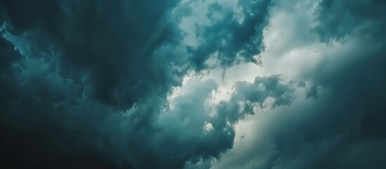 Naklejka na ściany i meble View of a dark cloudy sky before heavy rain falls